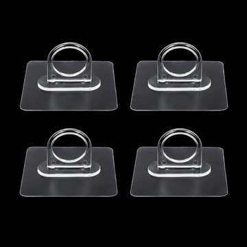 Adhesive plastic wall hook 4-piece set mounted on wall for home organisation