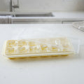 Ice cube tray with lid, perfect for making frozen treats and storing in freezer.