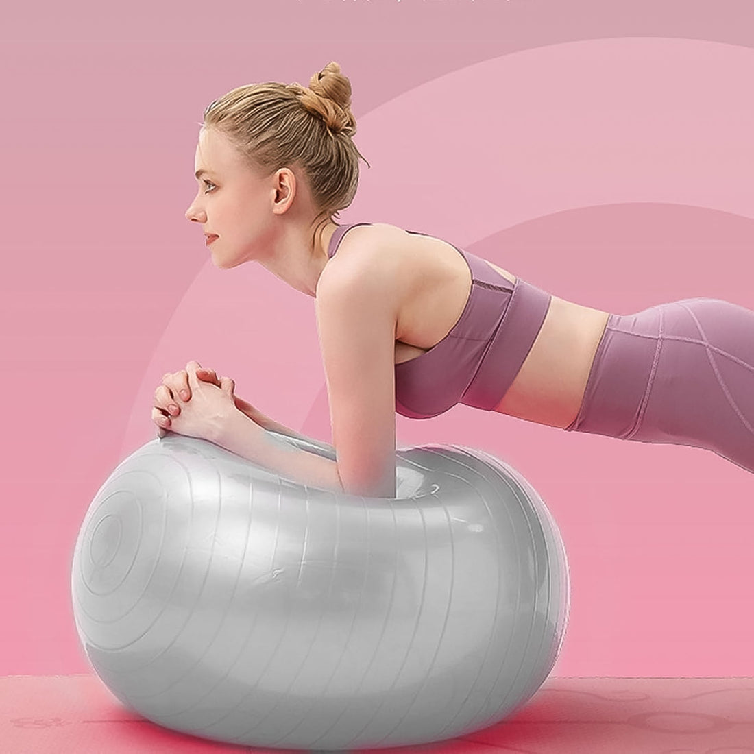 Woman performing Pilates exercises using 75CM stability gym ball