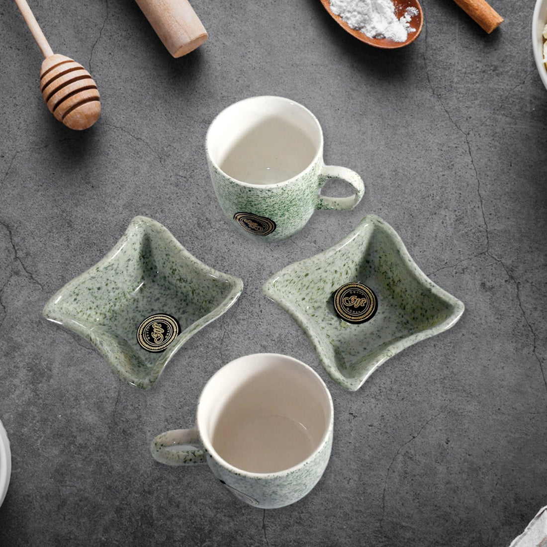 Elegant ceramic tea cup set with matching snack bowls, ideal for serving beverages and treats.