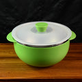 Ergonomic serving bowl with side handles and vented plastic lid