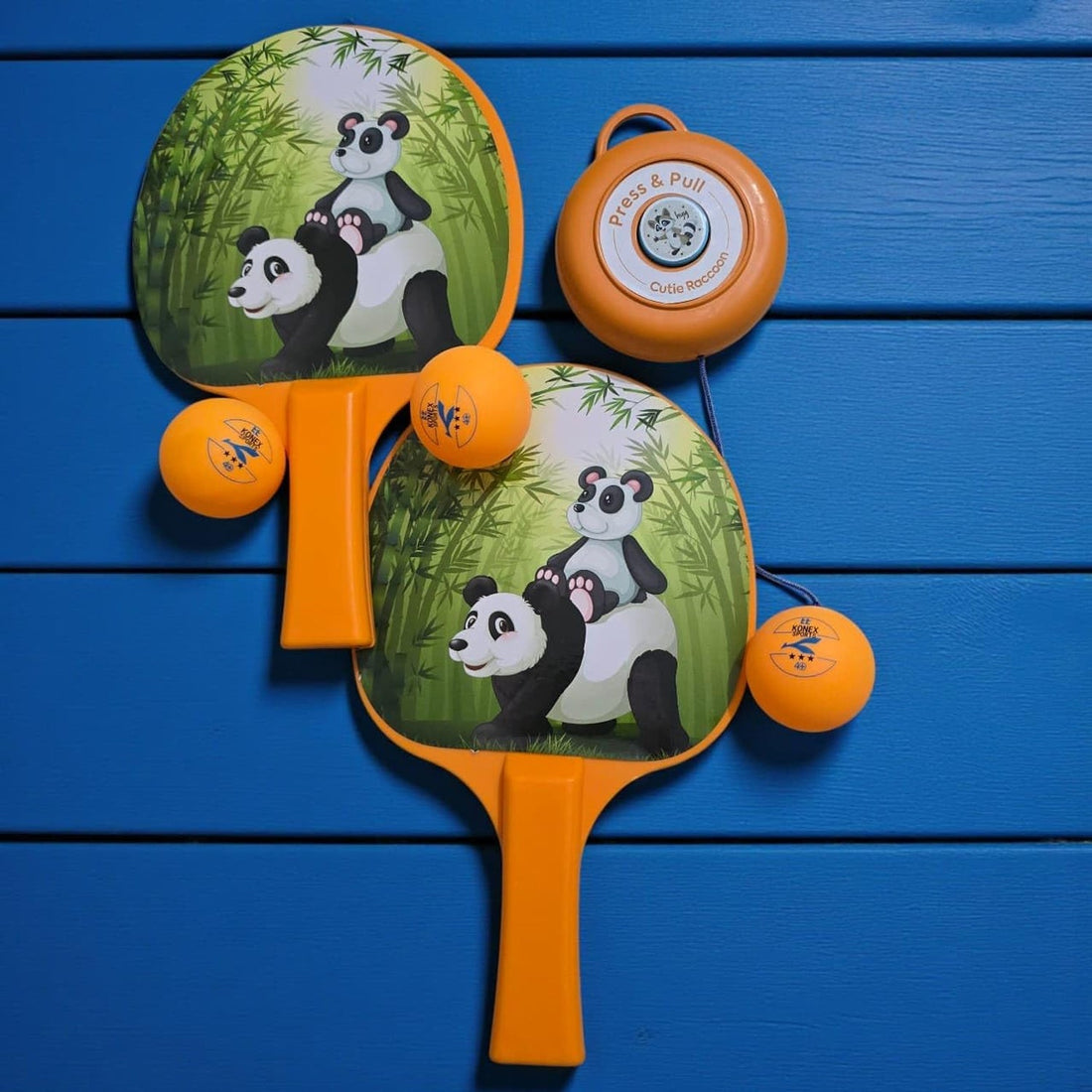 Children practicing with hanging table tennis trainer set indoors