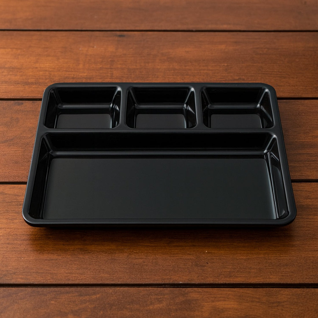 Durable plastic 4-compartment meal tray for portion control and organized dining.