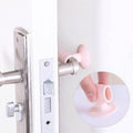 Silicone door stopper holding keys and cables neatly