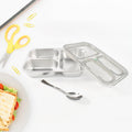 Stainless steel lunch box showing three separate food compartments for school meals