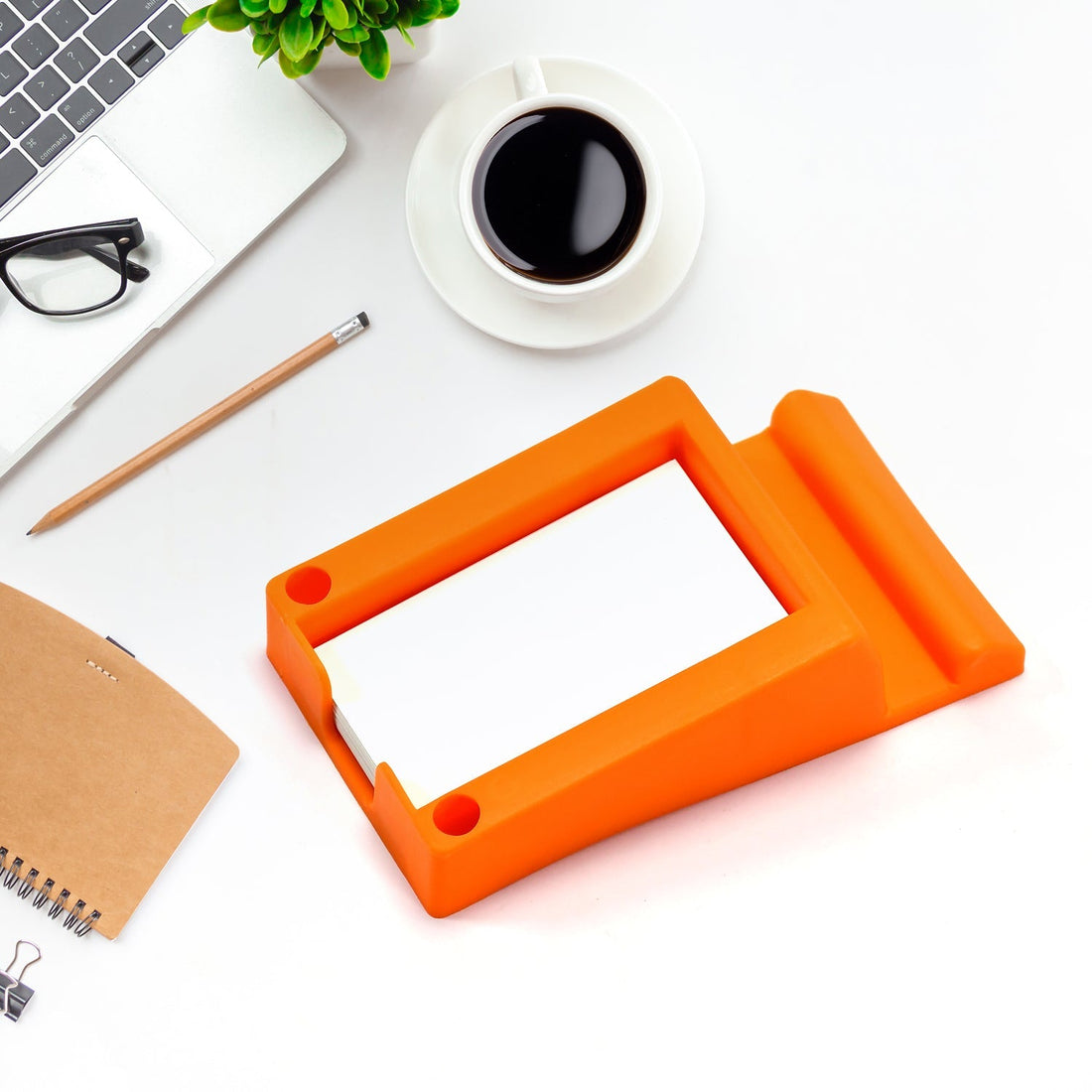 Plastic business card and mobile holder stand on desk