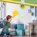 A lifestyle shot of the hanging table tennis trainer in use, providing indoor entertainment.