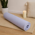 Yoga mat rolled for travel and home fitness use