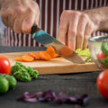 Durable natural wood cutting board on a kitchen counter.