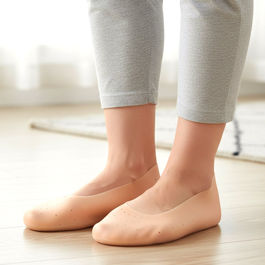 Pair of soft silicone heel protector socks to protect cracked heels
