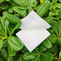 Cotton makeup remover pads laid on a clean surface for removing makeup