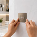 Self-adhesive plastic hook for organizing spaces