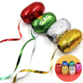 Close-up of a hand curling a balloon ribbon, showing its decorative effect.