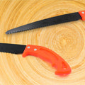 Detailed view of the teeth on the high carbon steel blade of the hand pruning saw.
