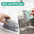 Close-up of the brush head tackling dirt in a narrow window slot.