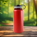 Reusable red stainless steel bottle for hot and cold drinks