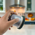 Grease remover scouring pad for kitchen surfaces