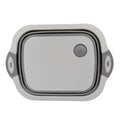 Versatile kitchen tool acting as both a cutting surface and a storage basket.