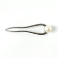 Close-up of pearl hair pin detail