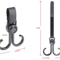 Universal stroller hook attached to a wheelchair handle, demonstrating versatility.