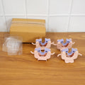 Four broom and mop holder clips mounted on wall organizing cleaning items