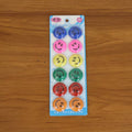 Multicolored smiley face magnetic buttons arranged in set