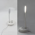 Compact Portable USB Fan and light connected to a power source.