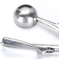 Ice cream scoop placed on a kitchen counter, ready to serve.