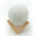 Close-up of the 3D moon lamp showcasing its detailed surface and touch sensor.