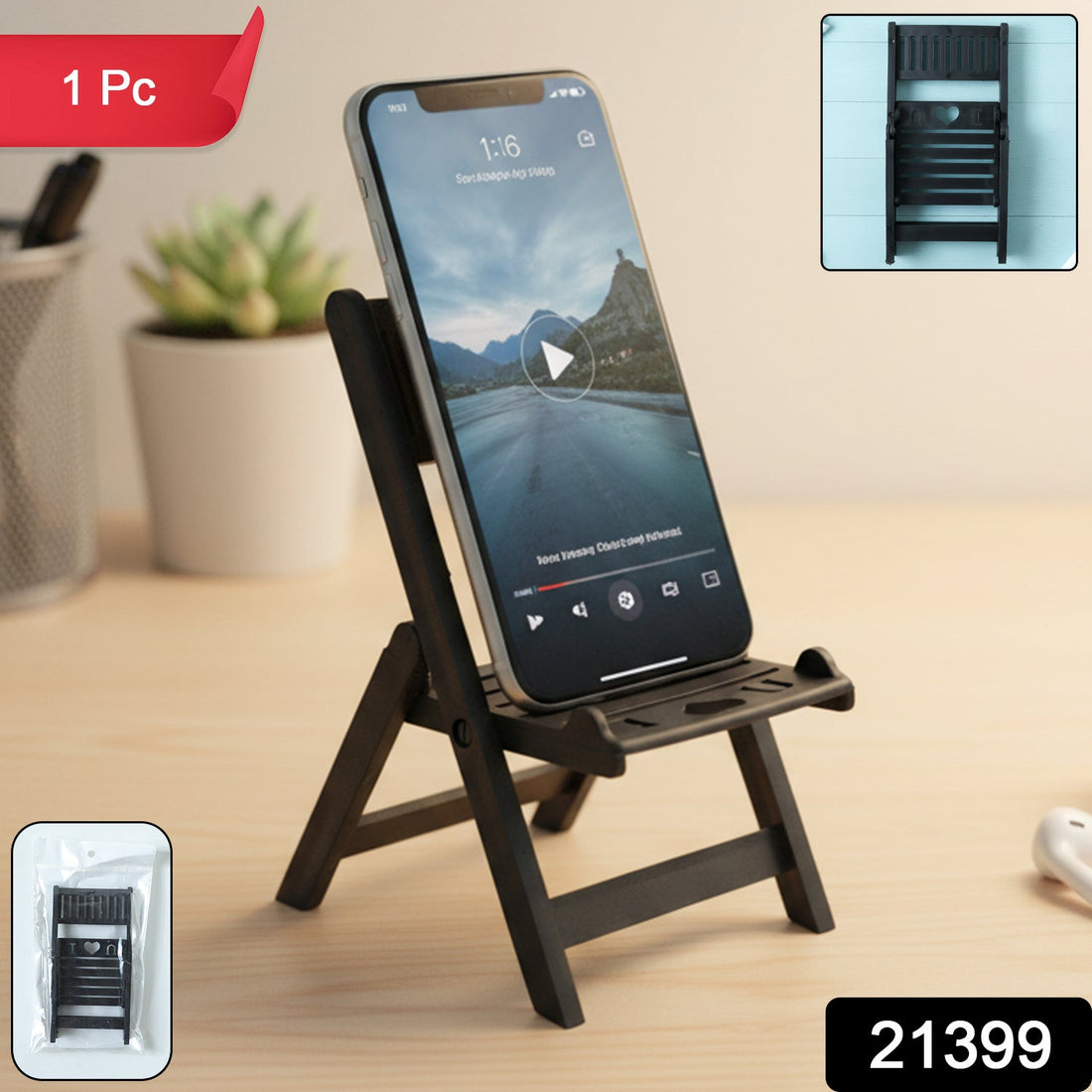 Mini chair shape black mobile stand holding smartphone on table