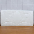 Textured white floral 3D foam wallpaper panel enhancing home interior aesthetics