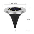 Single solar LED garden light glowing brightly at night in outdoor garden setting