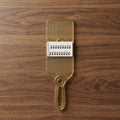 Handheld kitchen tool for vegetable and fruit slicing