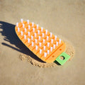 Detailed close-up of the durable, flexible bristles on the carrot brush.