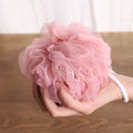 Ergonomic back scrubber with a soft loofah sponge for easy use.