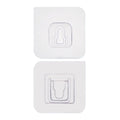 Adhesive wall hooks holding various kitchen utensils, showcasing their versatile use.