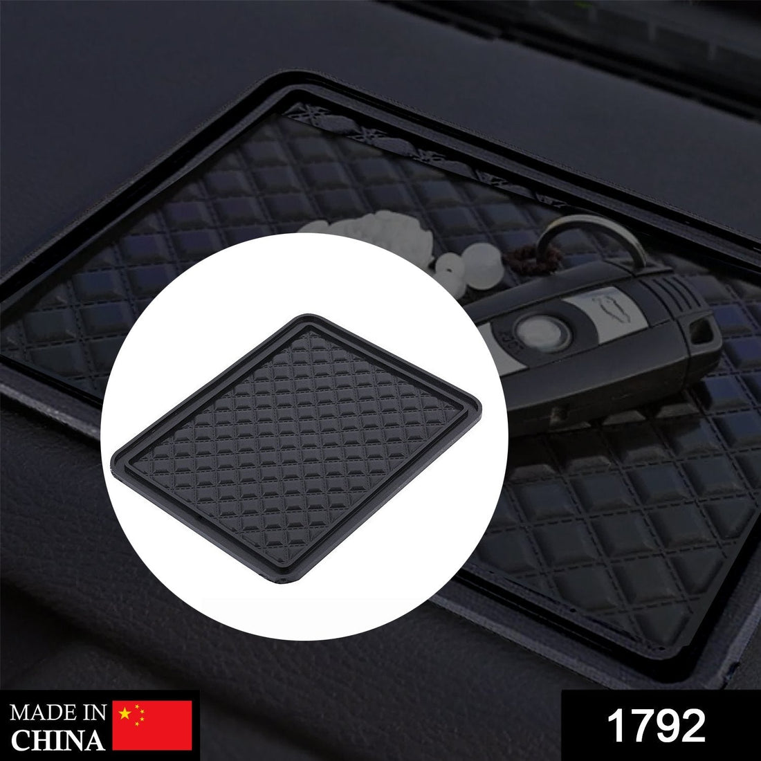 Black anti-skid mat securely holding a phone, keys, and sunglasses on a car dashboard.