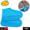 Two blue silicone rain boot covers with zig-zag textured soles, with a person wearing them in a small circular inset.