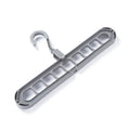 Several shirts and trousers neatly hung on the innovative 9-hole space saving hanger.