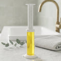 Toilet gel cleaner removing stains from toilet bowl surface