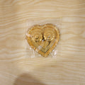 Packaged heart-shaped kumkum holder for gifting
