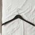 Hanger in use for wardrobe organization and clothes hanging
