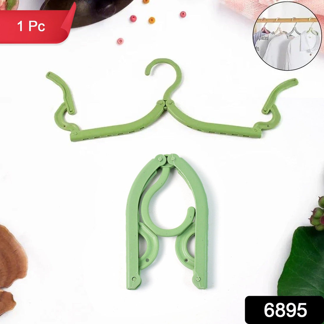 Foldable travel hanger made of durable ABS plastic, ideal for wrinkle-free clothes on the go
