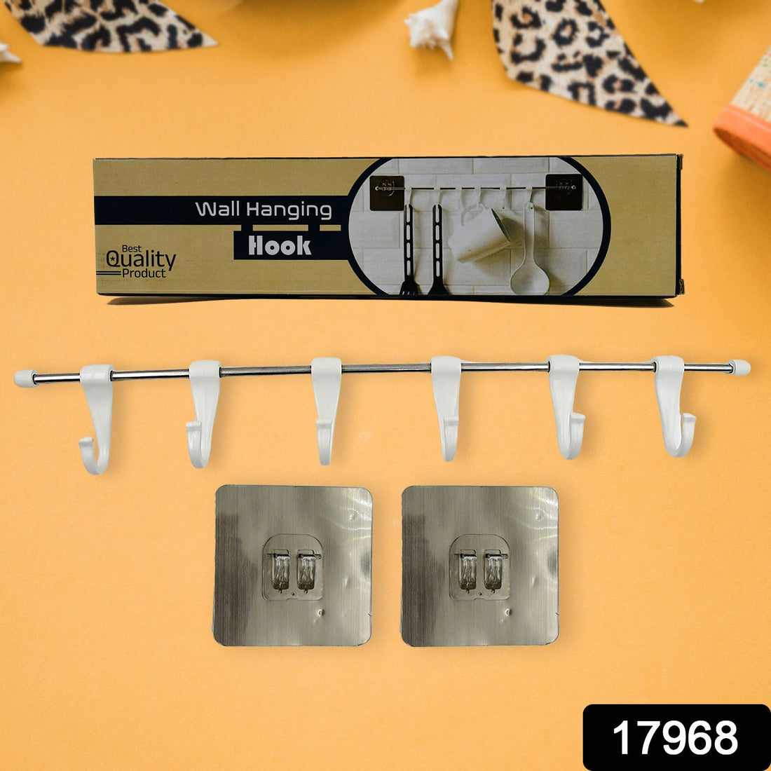 Stainless steel utensil hanger rail with 6 hooks installed on a clean kitchen wall, ready for use.