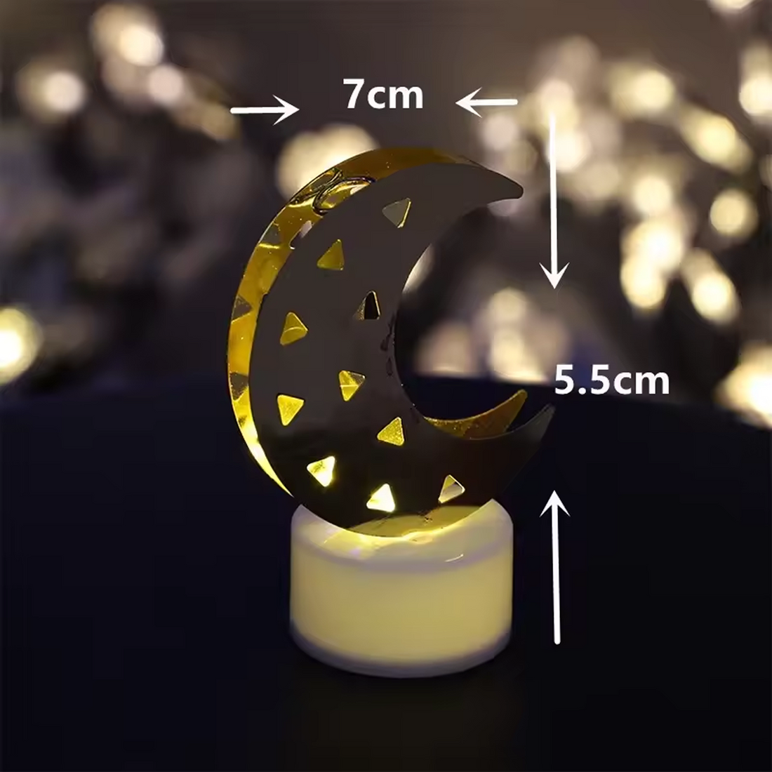 Moon shaped LED candle glowing with warm yellow light for ambient home decor
