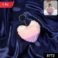 Heart shaped plush keychain attached securely to bag zipper