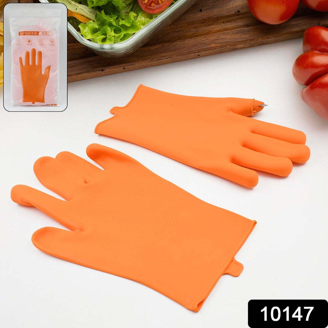 Orange silicone thumb knife finger protector glove for right hand, ready for use.