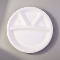 Profile view of Vegnar 4 compartment disposable food serving plate