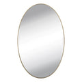 Self-adhesive frameless oval mirror sticker positioned above a dresser, perfect for dressing.