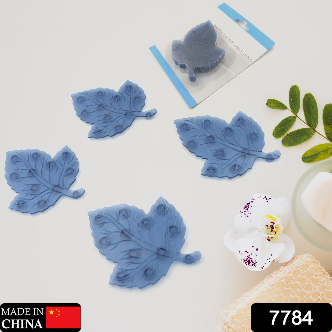 Four colorful leaf-shaped baby anti-slip bath mats with suction cups displayed.